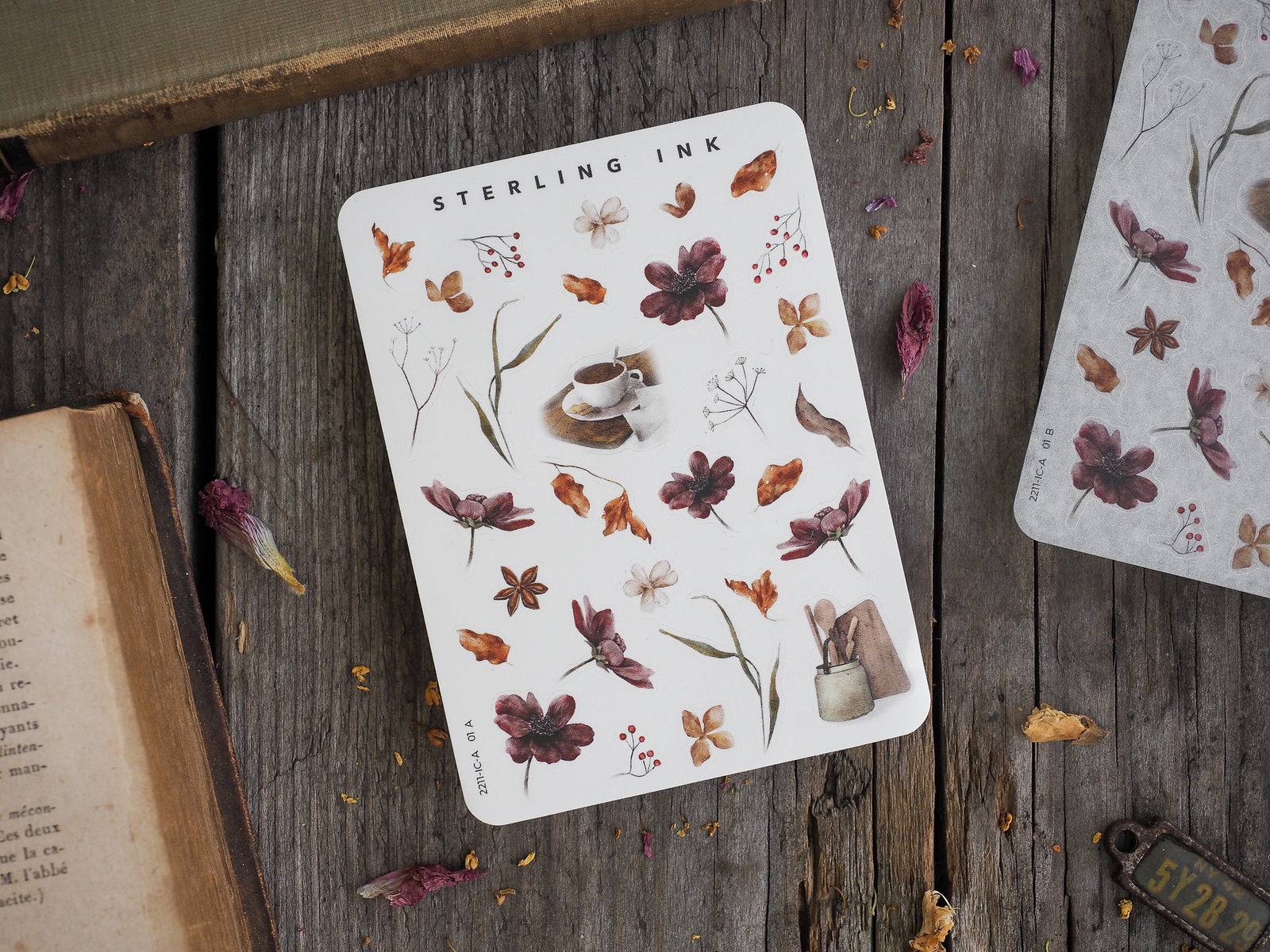 A mini sticker sheet featuring a collection of delicate botanical icons, including butterflies, leaves, berries, and flowers, perfect for journaling and seasonal crafts.