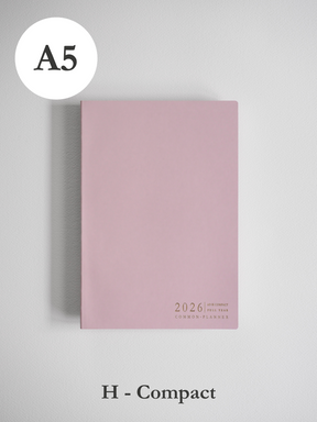Minimalist A5 planner cover in soft blush pink, featuring subtle centered text that reads "2026 Common Planner."