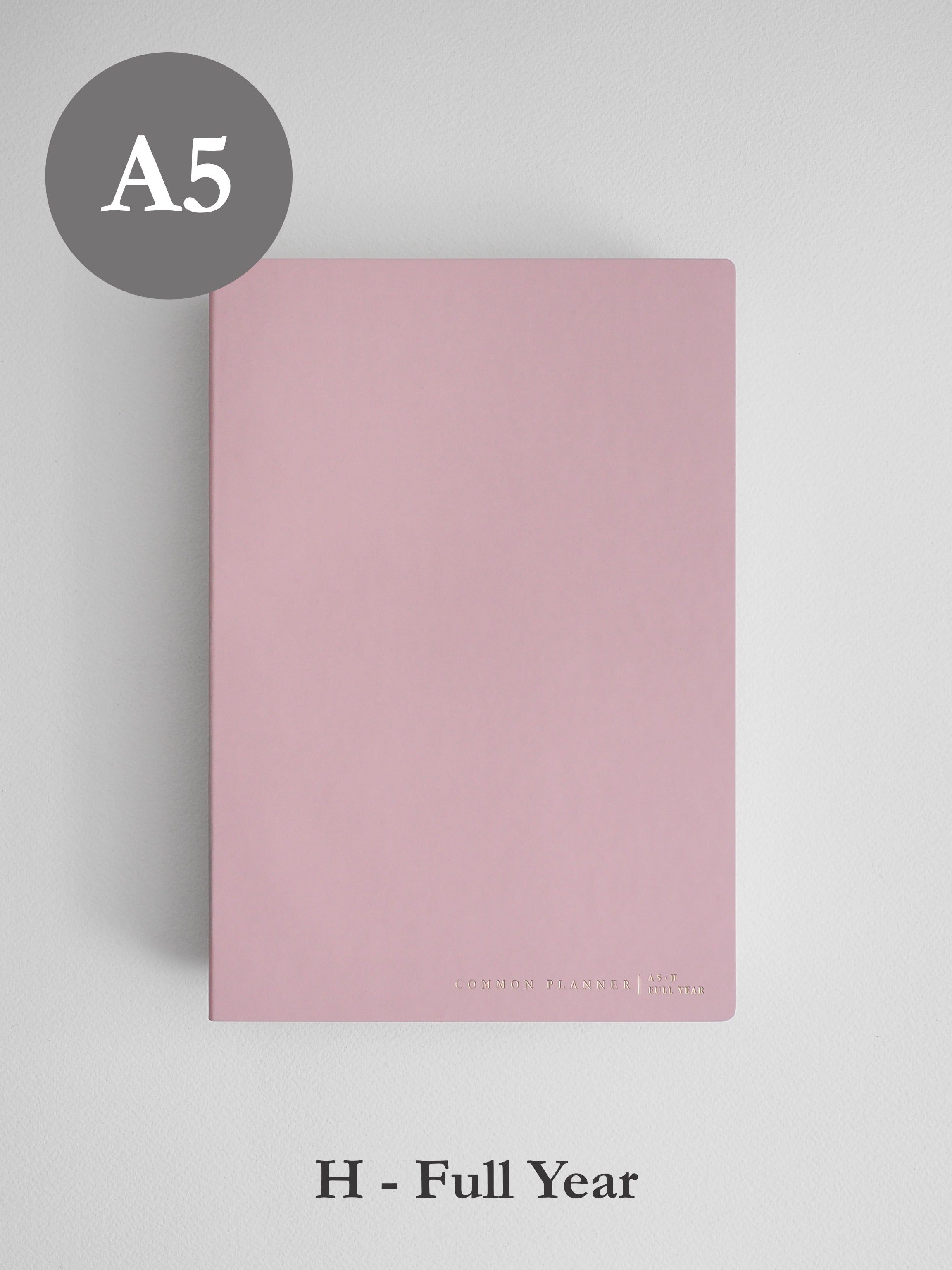 Minimalist solid blush pink A5 horizontal planner cover, designed for undated full year planning and featuring a clean, elegant aesthetic.