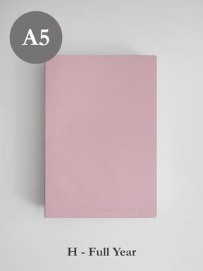 Minimalist solid blush pink A5 horizontal planner cover, designed for undated full year planning and featuring a clean, elegant aesthetic.