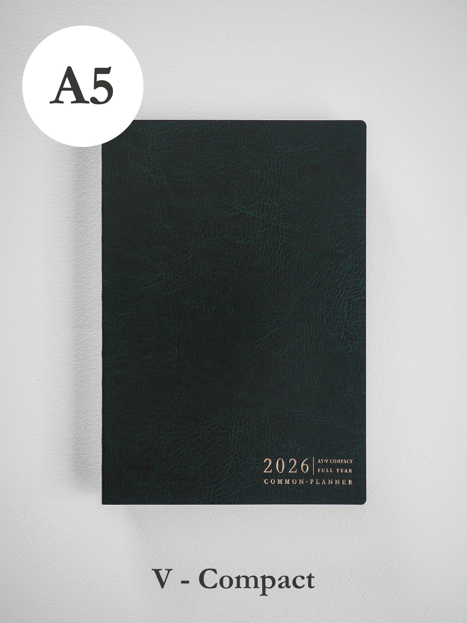 Dark charcoal A5 common planner with a matte cover, featuring minimalist typography and branding for the 2026 academic year.