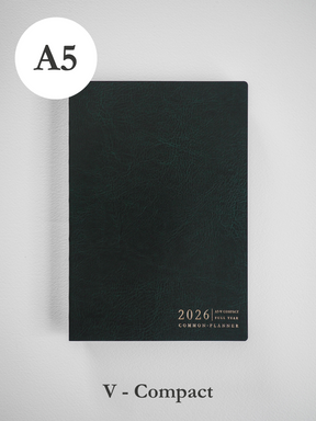 Dark charcoal A5 common planner with a matte cover, featuring minimalist typography and branding for the 2026 academic year.
