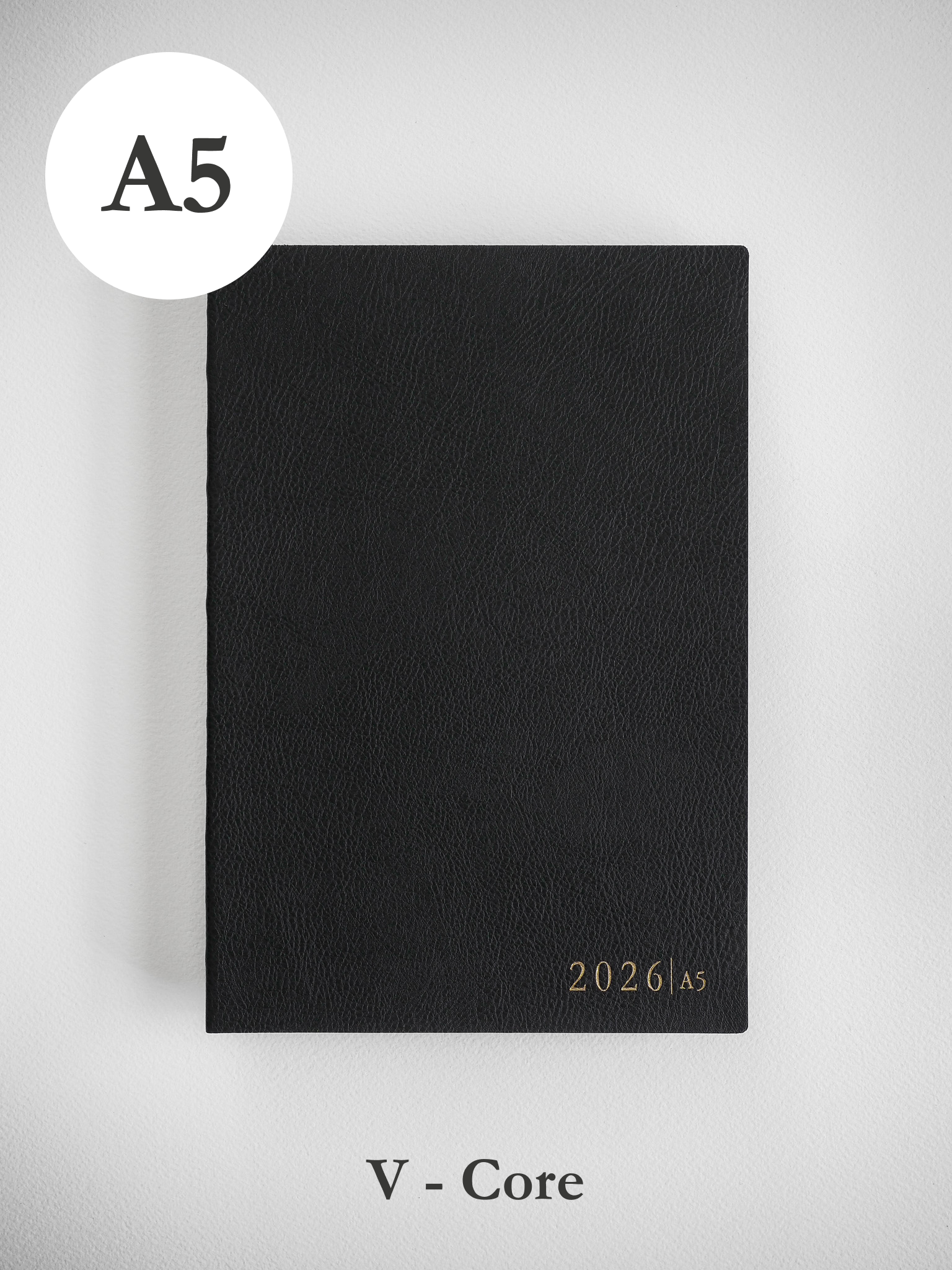 Minimalist black A5 planner cover displaying "2026 | A5" in a refined typeface, perfect for sophisticated full-year organization.
