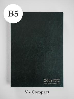 This B5 vertical planner has a deep charcoal, textured faux leather cover featuring subtle graining and minimal white text for 2026.
