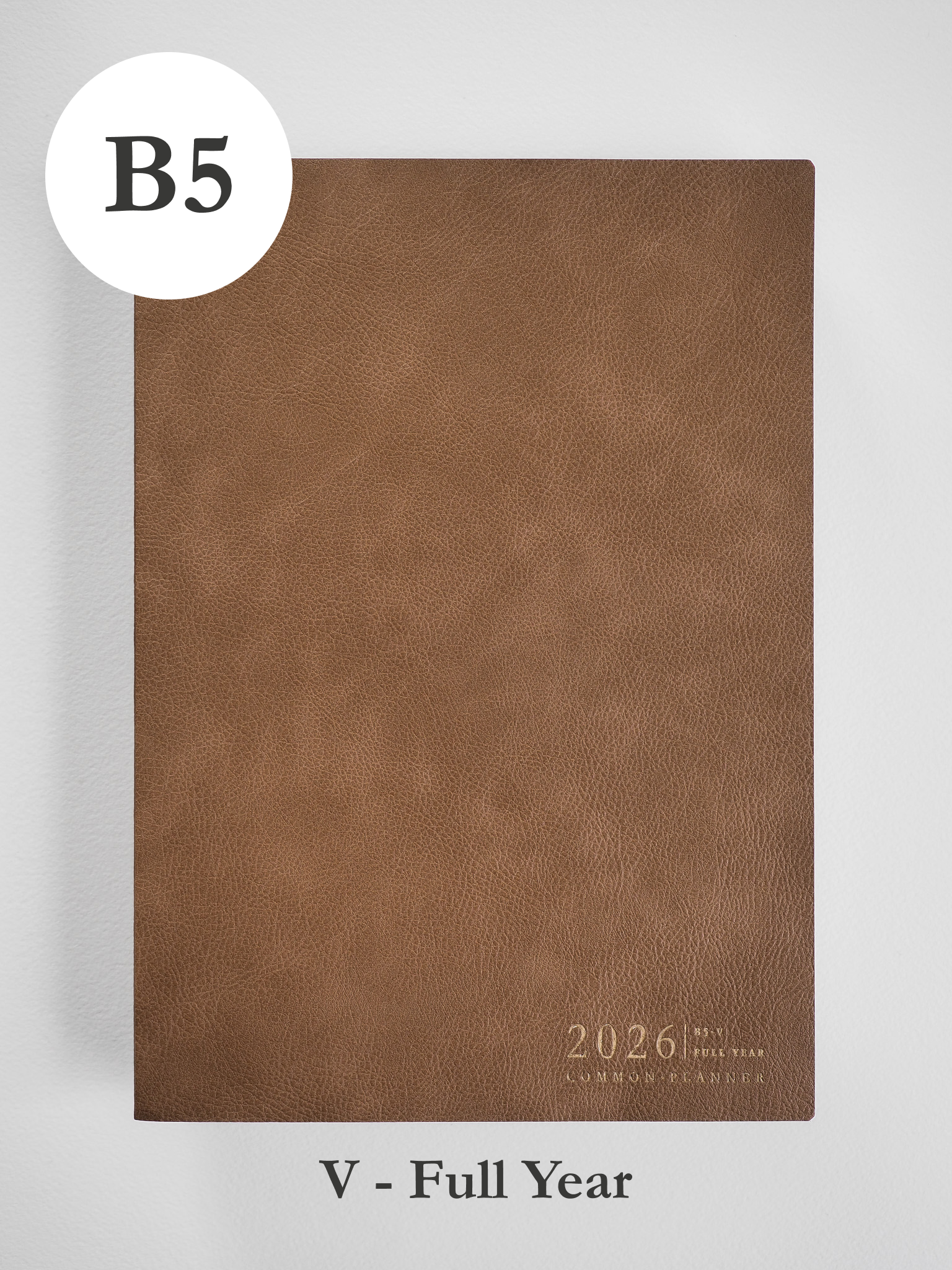 Tan B5 faux leather planner cover featuring embossed text that reads "2026 Common Planner," ready for a full year of scheduling.