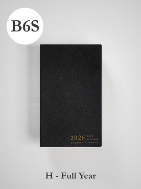 Sleek black B6 slim planner cover with a textured finish, featuring elegant gold foil lettering for the 2026 common planner.