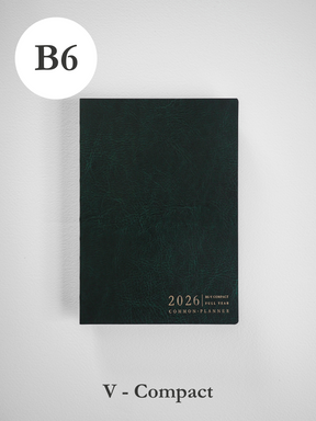 Compact B6 planner cover in deep, textured forest green, featuring minimalist embossed text detailing "2026 Full Year Common Planner."