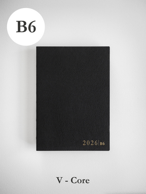 Minimalist, matte black vertical journal or book cover, branded with the clean, white text "2026 B6."
