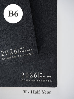 Matte black B6 planner bundle for 2026, displaying clean, minimalist white text identifying "Part One" and "Part Two" for a coordinated half-year planning system.
