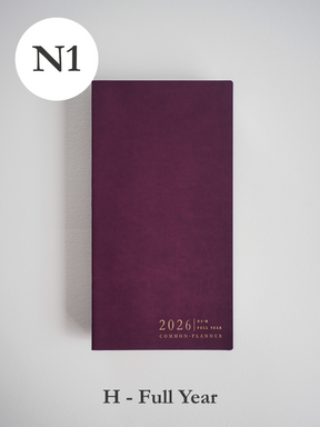 Deep burgundy planner cover featuring clean, minimalist typography that reads "2026 Common Planner" across the bottom center.