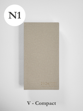 Compact, vertical planner featuring a light beige, kraft-colored cover subtly stamped with the year 2026 and "Common Planner."