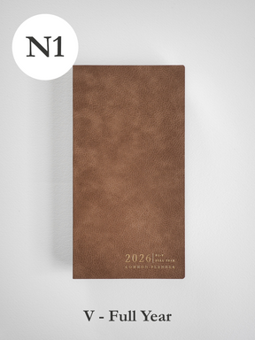 Matte, vertical brown planner cover with a textured, faux-leather finish, featuring elegant gold foil lettering for "2026" and "Common Planner."