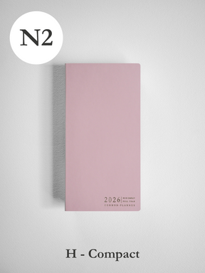 Blush pink horizontal compact planner for 2026, featuring common planner branding and a sophisticated, minimalist design.