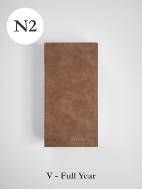 Minimalist full-year planner cover in warm tan faux leather, featuring a simple debossed "2026" marker for easy planning.
