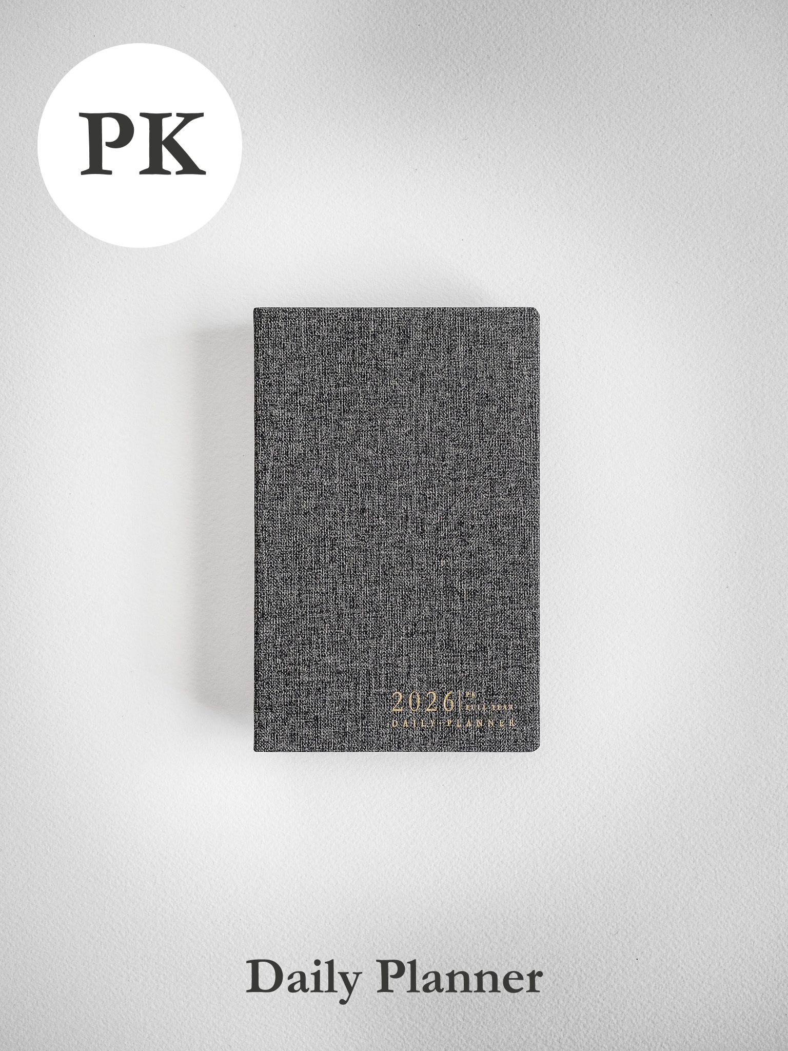 Compact, charcoal-grey daily planner featuring a textured cover and elegantly printed "2026" date and title for full-year planning.