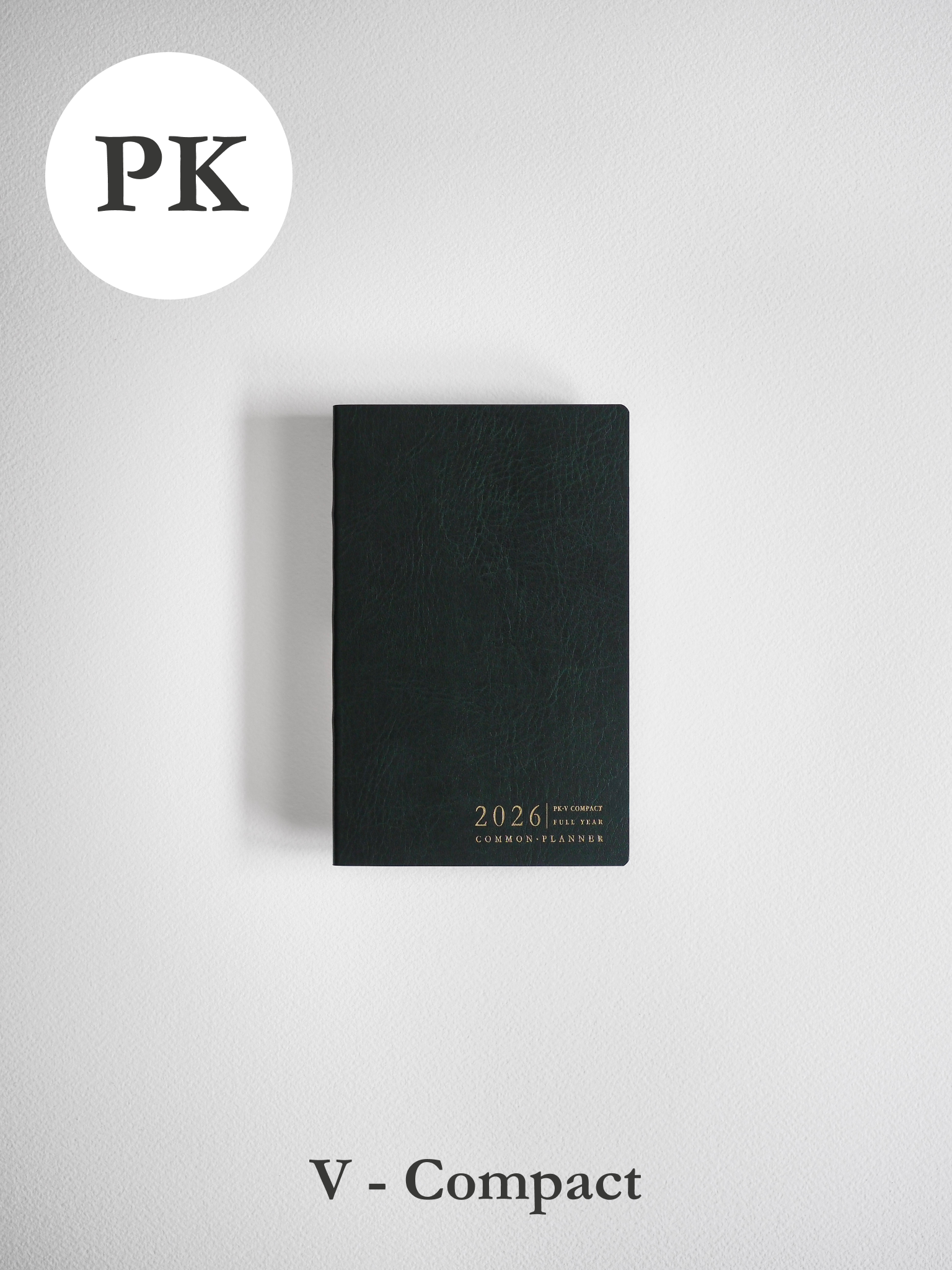 Sleek, matte black vertical pocket planner featuring minimalist centered typography that reads "2026 Full Year Common Planner."