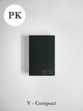 Sleek, matte black vertical pocket planner featuring minimalist centered typography that reads "2026 Full Year Common Planner."