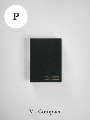 A dark, textured 2026 planner featuring "COMMON PLANNER" embossed in gold lettering on its solid black cover.