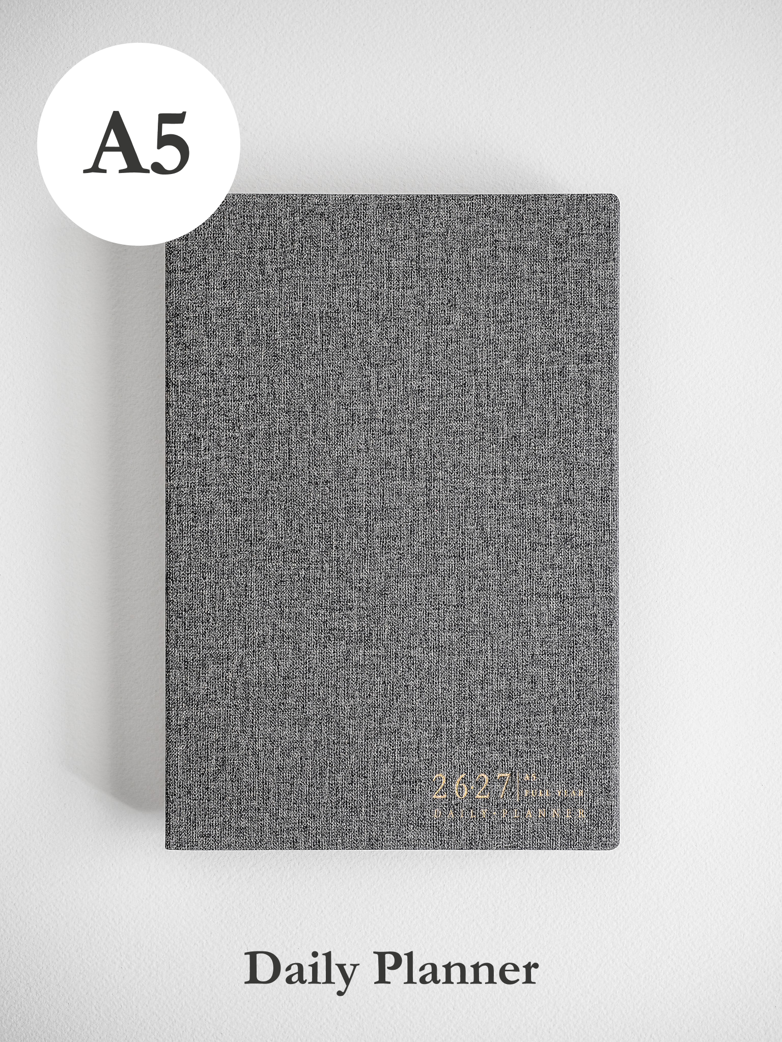 A sophisticated A5 academic daily planner featuring a heather gray, textured cover and subtle, centered printing for the 2026-2027 year.