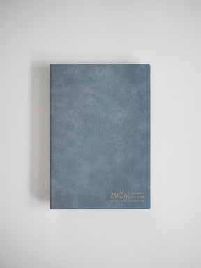 Textured slate gray A5 planner featuring a minimalist design with the year 2026 printed in delicate gold lettering.