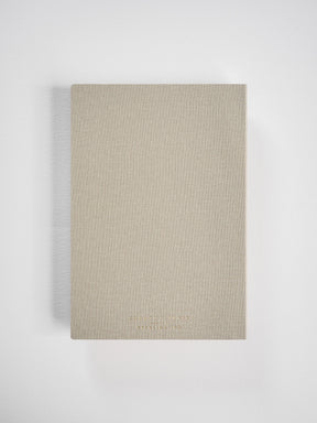 Neutral tan A5 planner featuring a linen-textured cover, displaying minimalist branding for Edmond Planner and Sterling Ink.