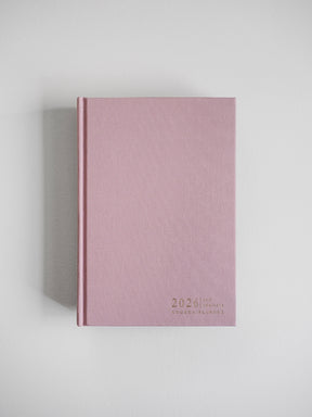 Minimalist A5 planner in a dusty rose hue, featuring the centered text "2026" and "Common Planner" for a subtle, elegant look.