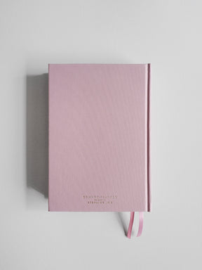 Soft blush pink A5 planner featuring centered "Common Planner" branding and a matching ribbon accent, ready for planning the full year.