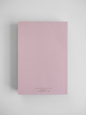 Soft blush pink A5 planner cover for 2026, featuring centered elegant lettering that reads "Common Planner designed by Sterling Ink."