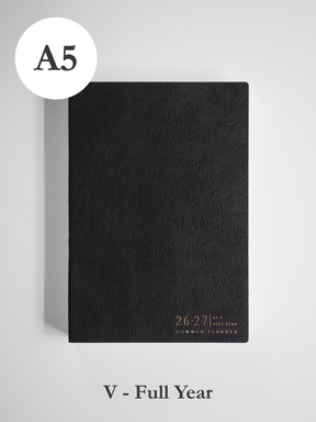 Black A5 vertical academic planner with a faux leather cover, featuring embossed text for the 2026-2027 full year common planner theme.
