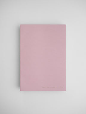 Minimalist light pink planner cover featuring a solid, soft blush hue and the branding "COMMON PLANNER | LIVE" at the bottom.