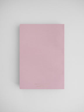 Pale pink, vertically oriented planner journal featuring minimalist, elegant typography branding for the "Common Planner."