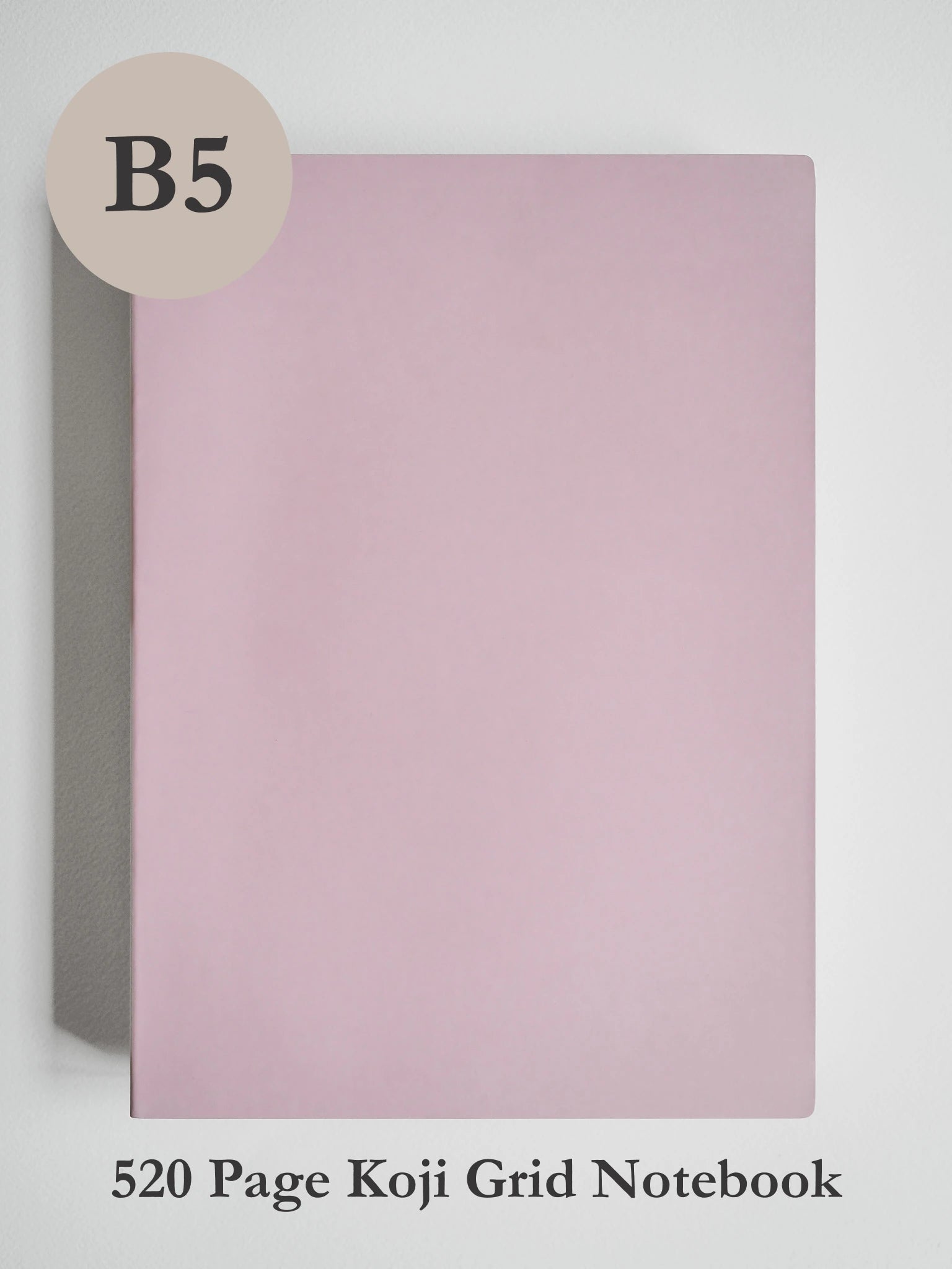 A pink A5 size koji grid notebook shown against a light gray background, with a beige circle label reading 'A5' in the top left and text at the bottom reading '272 Page Koji Grid Notebook'.
#Color_Fairyfloss