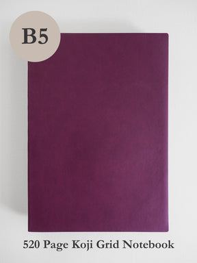 A dark purple B5 size koji grid notebook shown against a light gray background, with a beige circle label reading 'B5' in the top left and text at the bottom reading '520 Page Koji Grid Notebook'.
#Color_Mulberry
