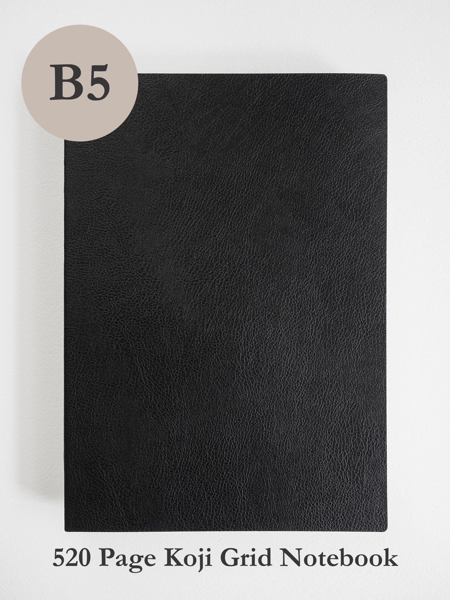 A black textured notebook cover shown flat against a light gray background, with a beige circle labeled 'B5' in the top left and text at the bottom reading '520 Page Koji Grid Notebook'.
#Color_Onyx