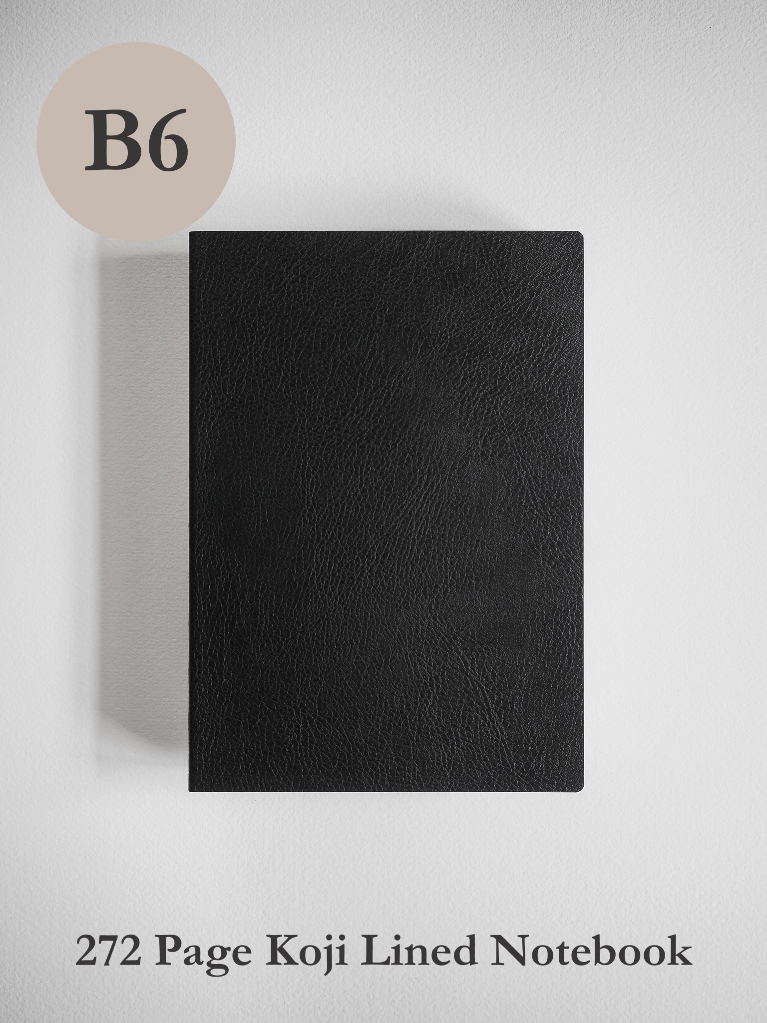Solid black B6 lined notebook with a matte cover, offering a sleek and minimalist journal for writing and notes.