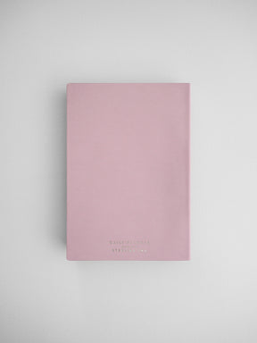 Pale pink B6 daily planner journal featuring minimalist black typography and labeled "Daily Planner" by Sterling Ink.