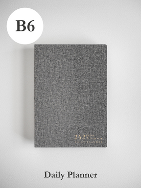 Stylish B6 academic daily planner with a textured dark gray cover featuring gold foil text for the 2026-2027 academic year.