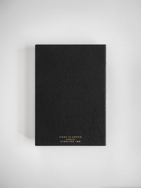 Structured black B6 planner featuring subtle text embossing for the "CORE PLANNER" series, designed by Sterling Ink for organized yearly planning.