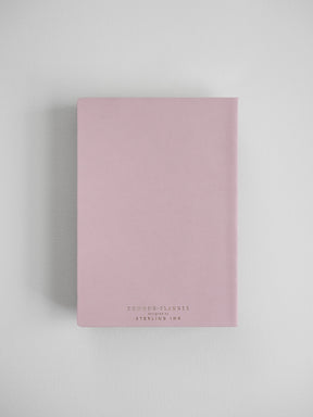 Elegant blush pink B6 vertical planner cover featuring centered branding text that reads "COMMON PLANNER" and "STERLING INK."