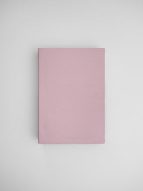 Minimalist B6 half-year planner featuring a dusty rose cover, marked with "Common Planner," ideal for tracking schedules or journaling.