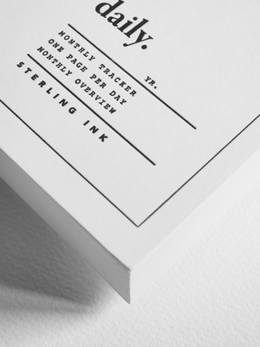 Minimalist white dated planner insert featuring elegant black typography for daily tracking, monthly organization, and academic scheduling.