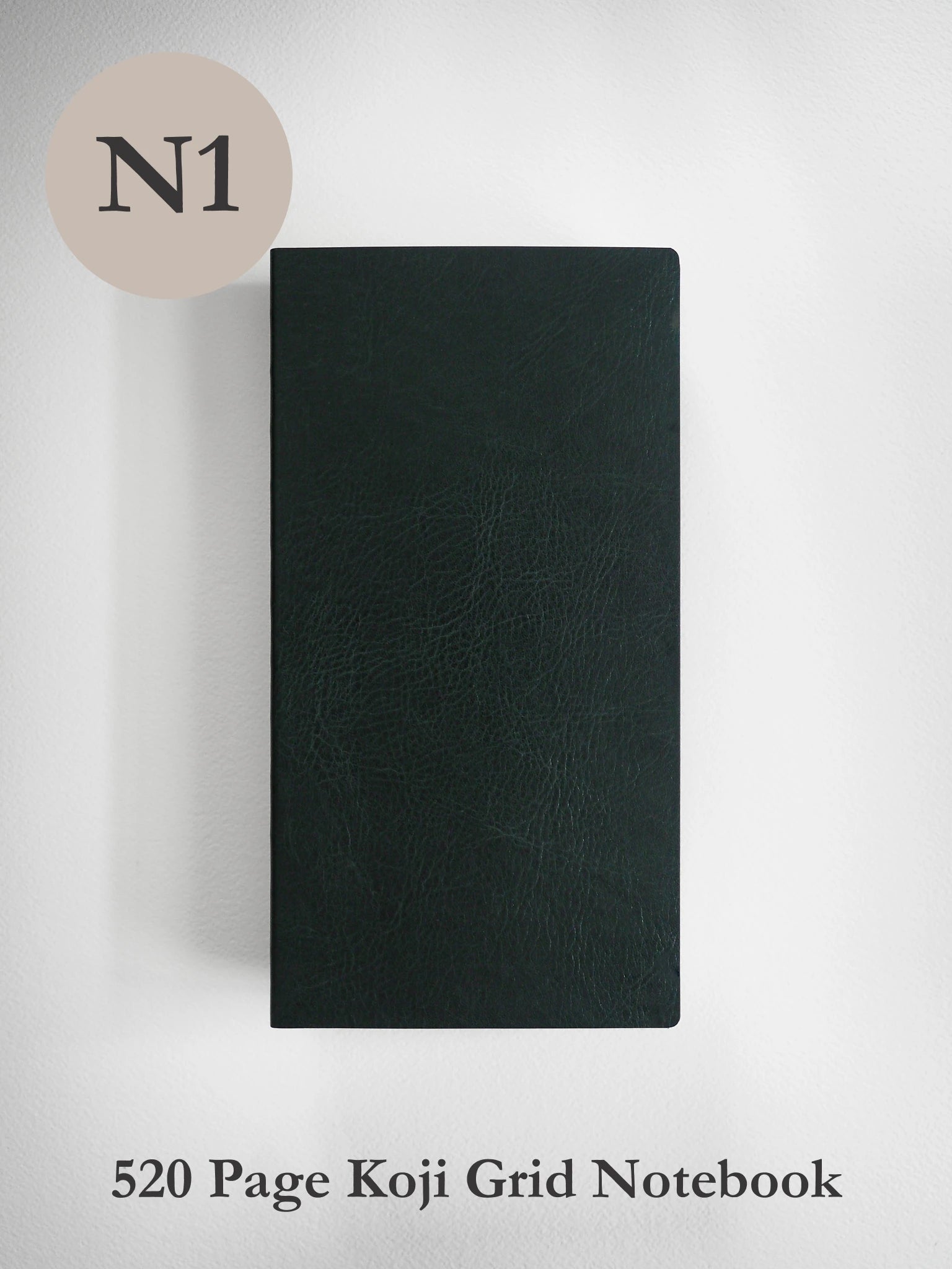 A dark forest green textured notebook shown vertically against a light gray background, with a beige circle containing 'N1' in the top-left corner and the text '520 Page Koji Grid Notebook' at the bottom.
#Color_Forest