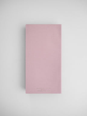 Blush pink daily planner with a clean, minimalist design, featuring "Daily Planner Sterling Linx" printed in a centered, elegant typeface.