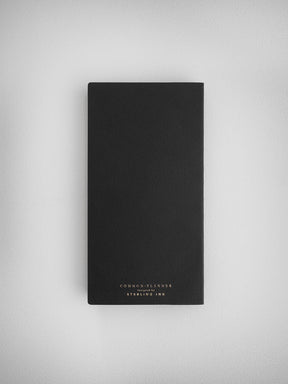 Sleek black common planner designed by Sterling Ink, featuring a minimalist cover for undated, horizontal journaling use.