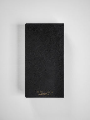 Textured black common planner featuring elegant gold foil typography displaying "COMMON PLANNER" and "STERLING INC" branding.