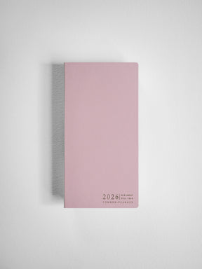Minimalist blush pink compact planner featuring centered black text that reads "2026 N2-H Compact Full Year Common Planners."