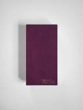 Minimalist burgundy planner cover featuring elegant gold lettering that displays "2026 N2 Horizontal Full Year Common Planner."