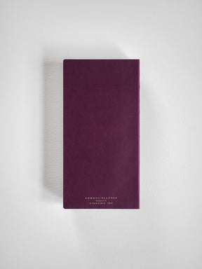 Deep plum-colored 2026 common planner book featuring minimalist gold foil text that reads "COMMON PLANNER" and "STERLING INK."