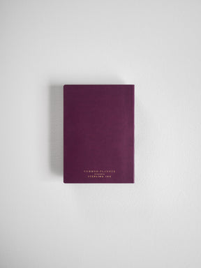 Compact, deep burgundy planner featuring elegant gold-toned branding for "Common Planner" and "Sterling Ink."