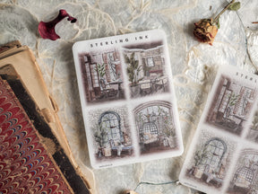 Sheet of vintage, sepia-toned illustration stickers featuring architectural sketches of quaint windows and cozy interior domestic scenes for February 2024.